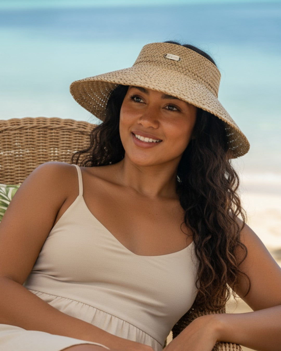 Woman wearing a straw hat on a beach